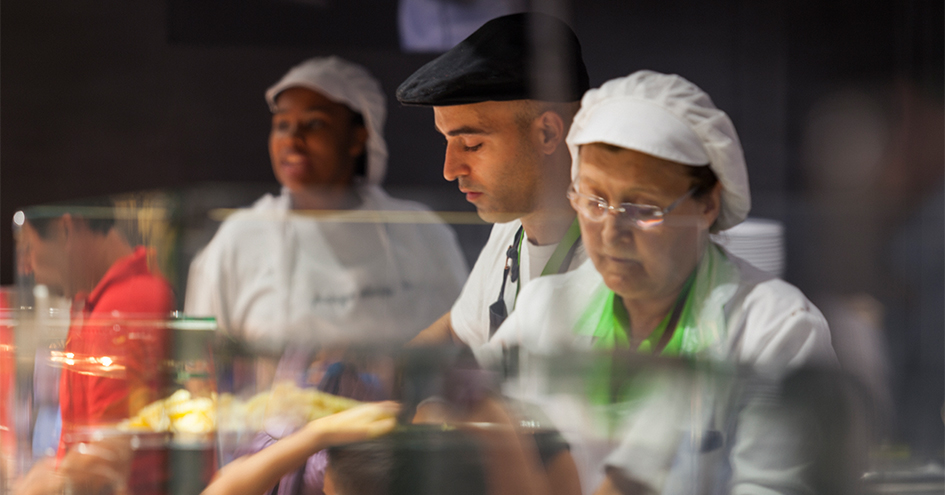 Three employees of different ages concentrated at work (photo)