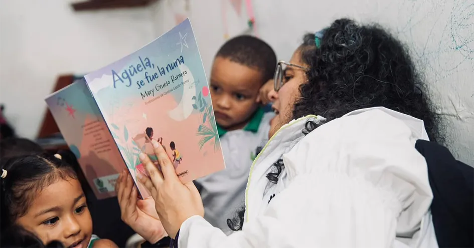 A woman reading to children 